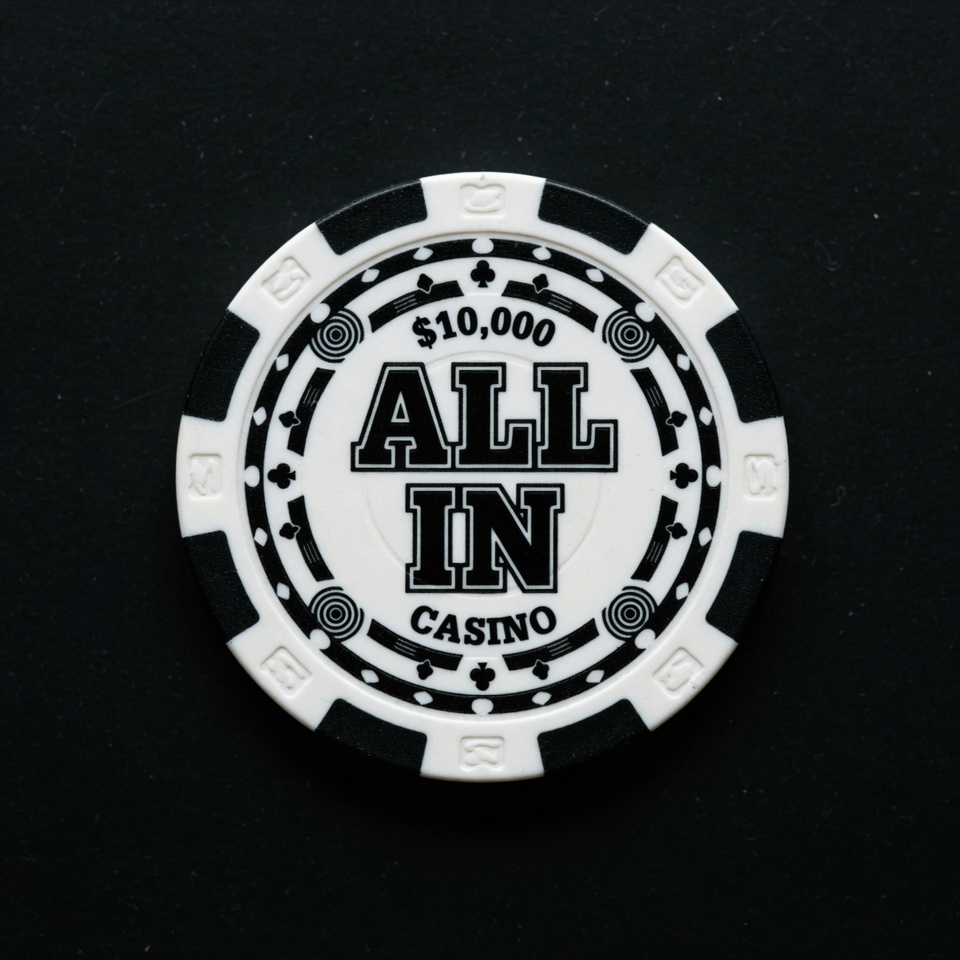 ALL IN $10,000 casino chip on a black background.